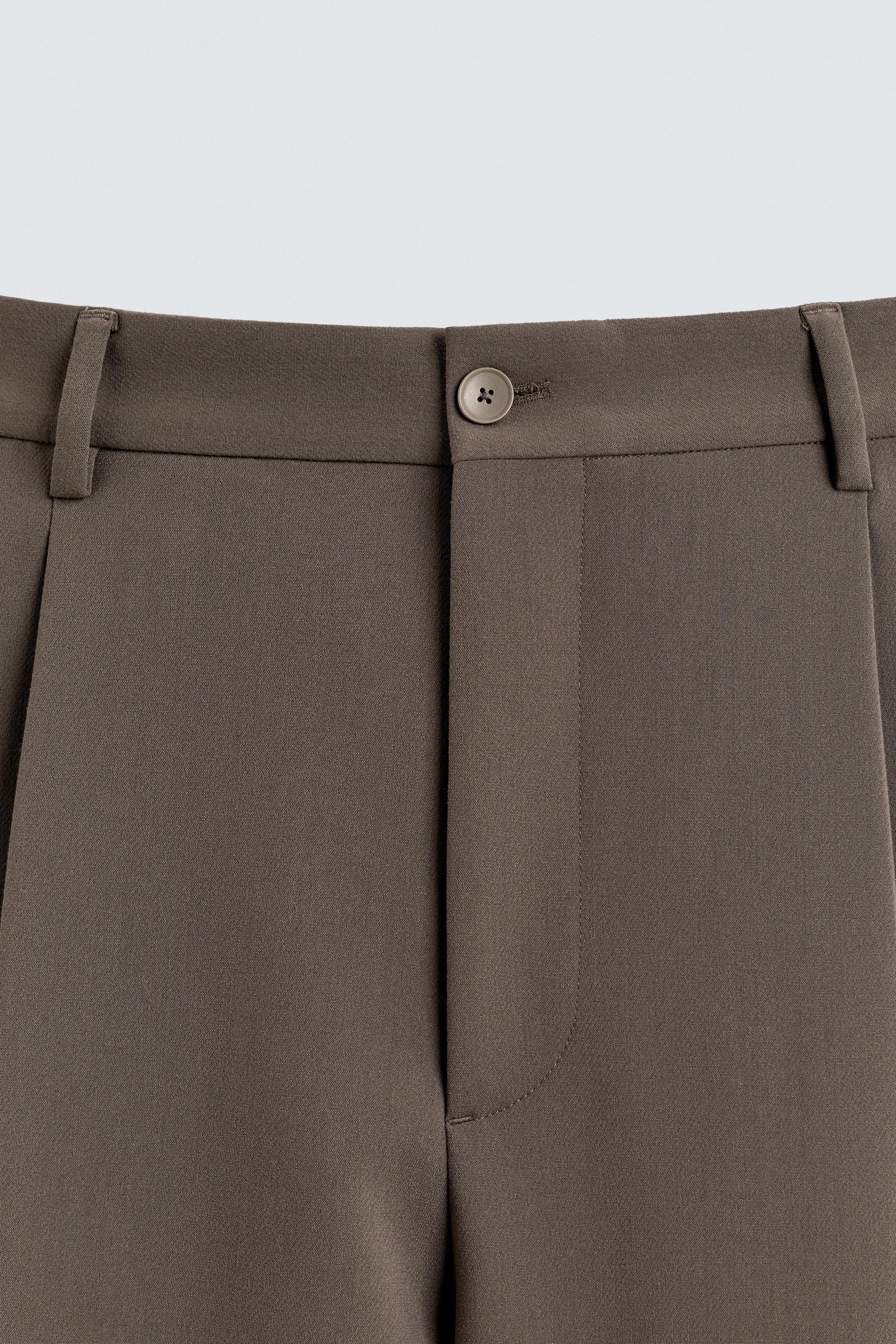 PANTALON RELAXED FIT À PLIS